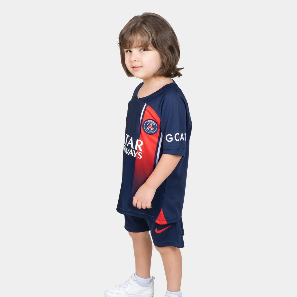 Paris Saint Germain Kids Kit Home Season 23/24 Designed By Mitani Store , Regular Fit Jersey Short Sleeves And V-Neck Collar In Dark Blue Color